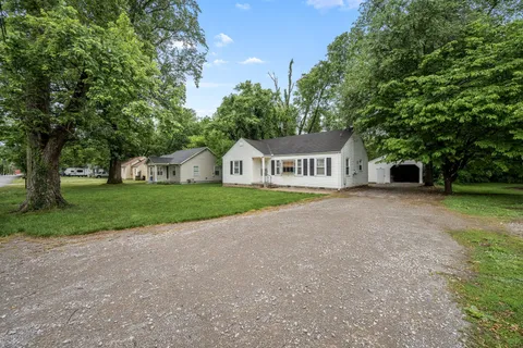 a house with tree in front of it