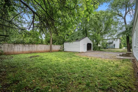 a house view with a backyard space