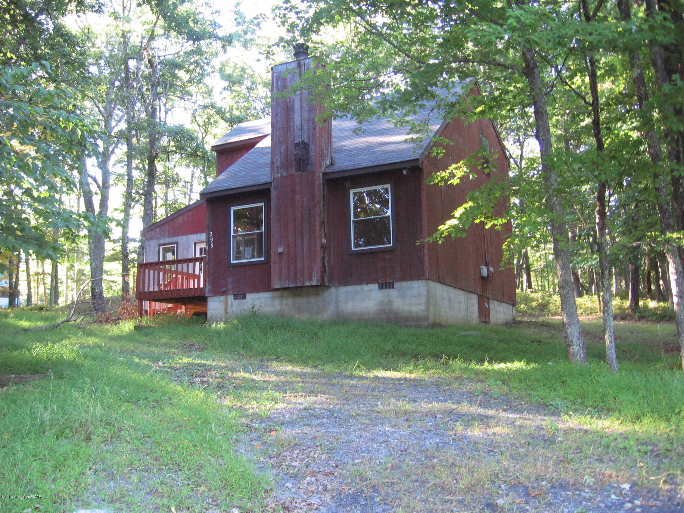 142 Doe Loop Bushkill, PA 18324 - Photo 2 of 10 a view of a yard in front of a house with large tree