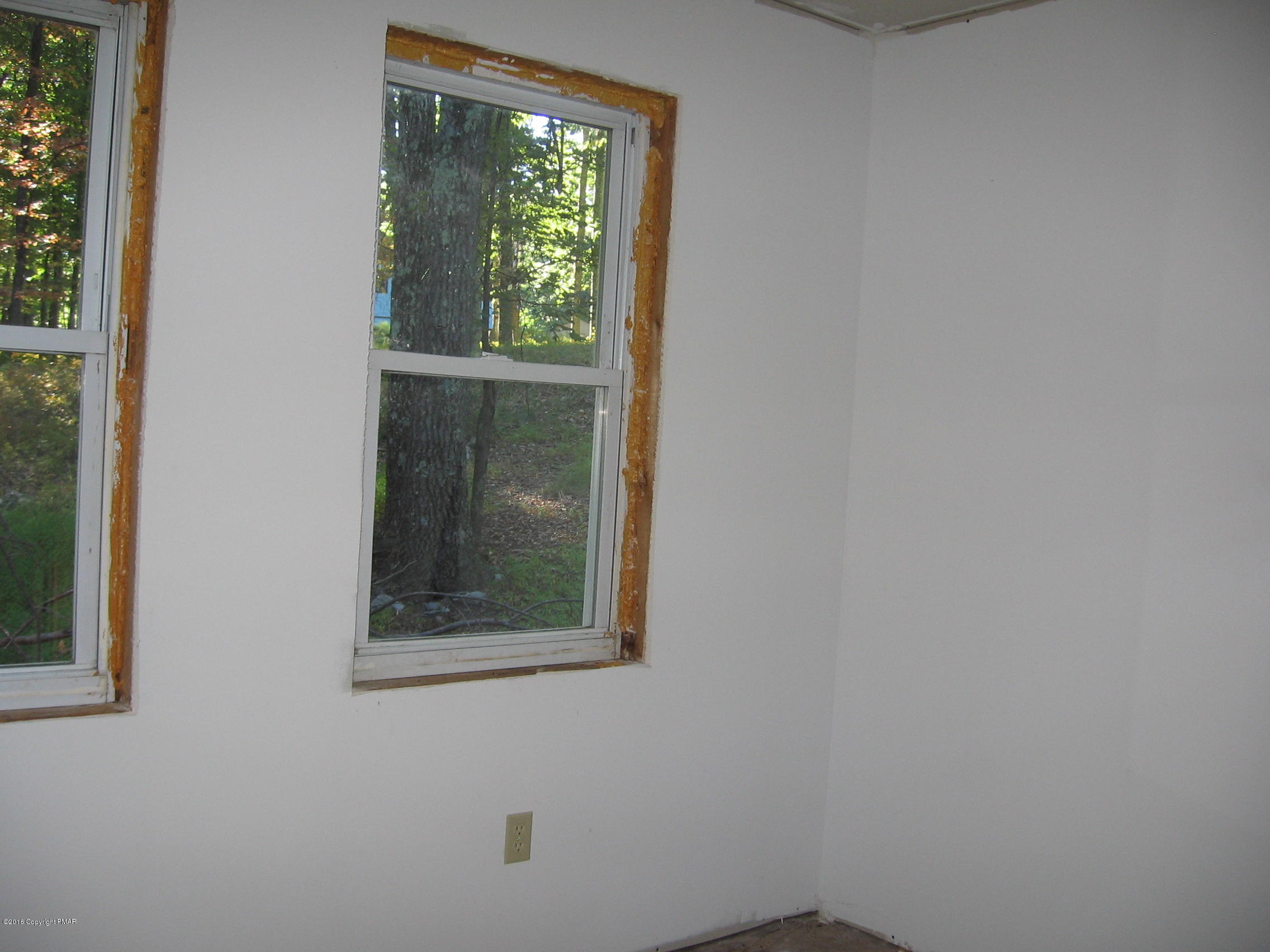 142 Doe Loop Bushkill, PA 18324 - Photo 4 of 10 a view of an front door