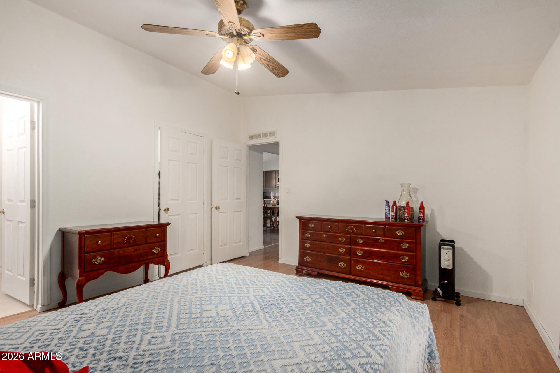 6751 West Nancy Road Peoria, AZ 85382 - Photo 16 of 29 a bedroom with a bed and a dresser