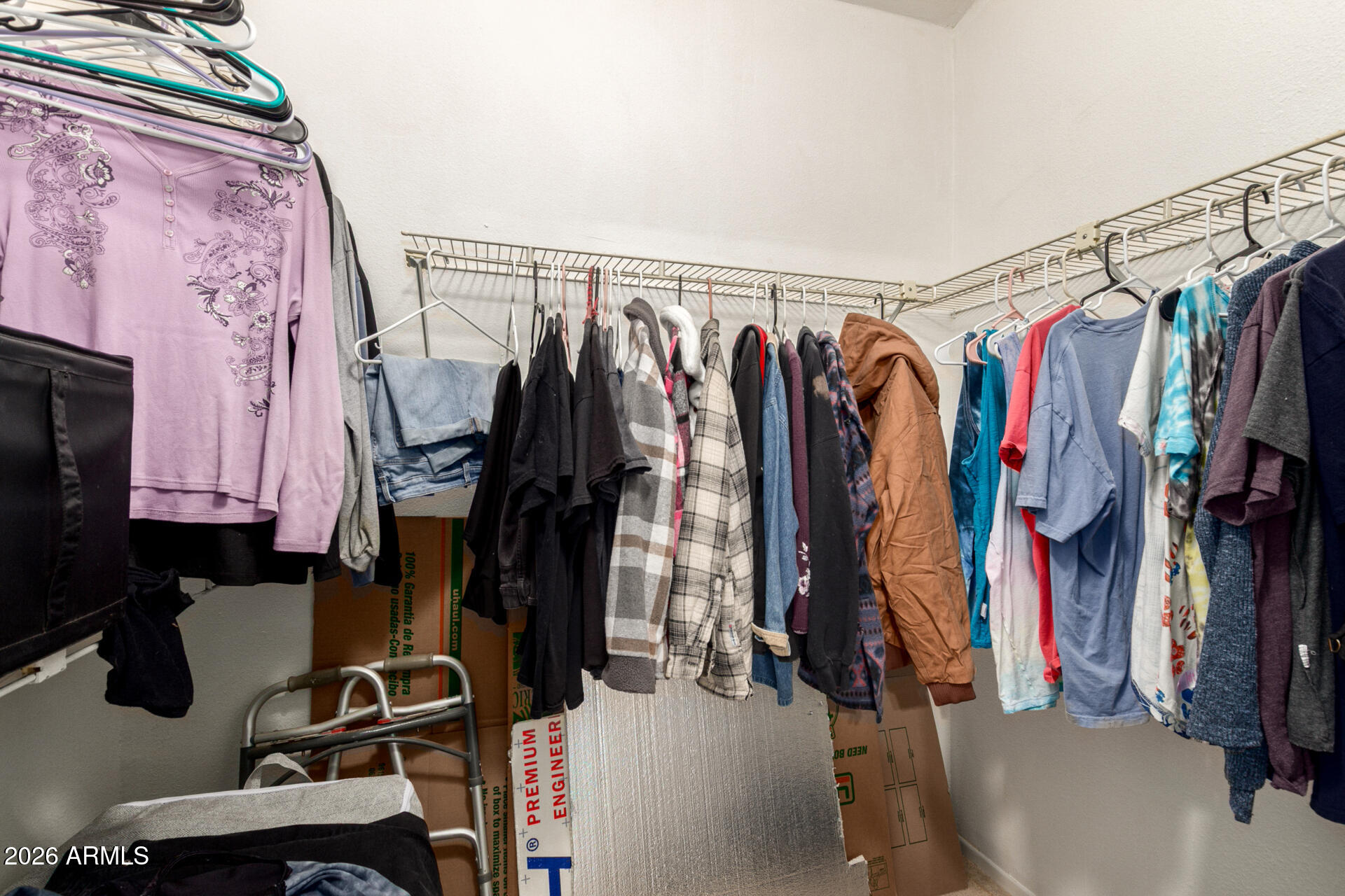 6751 West Nancy Road Peoria, AZ 85382 - Photo 19 of 29 a view of walk in closet with clothes