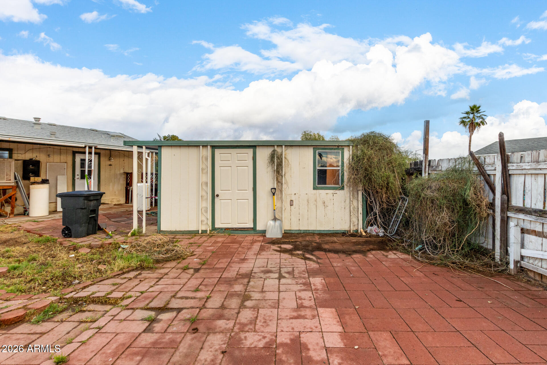 6751 West Nancy Road Peoria, AZ 85382 - Photo 26 of 29 a view of a house with backyard and garden
