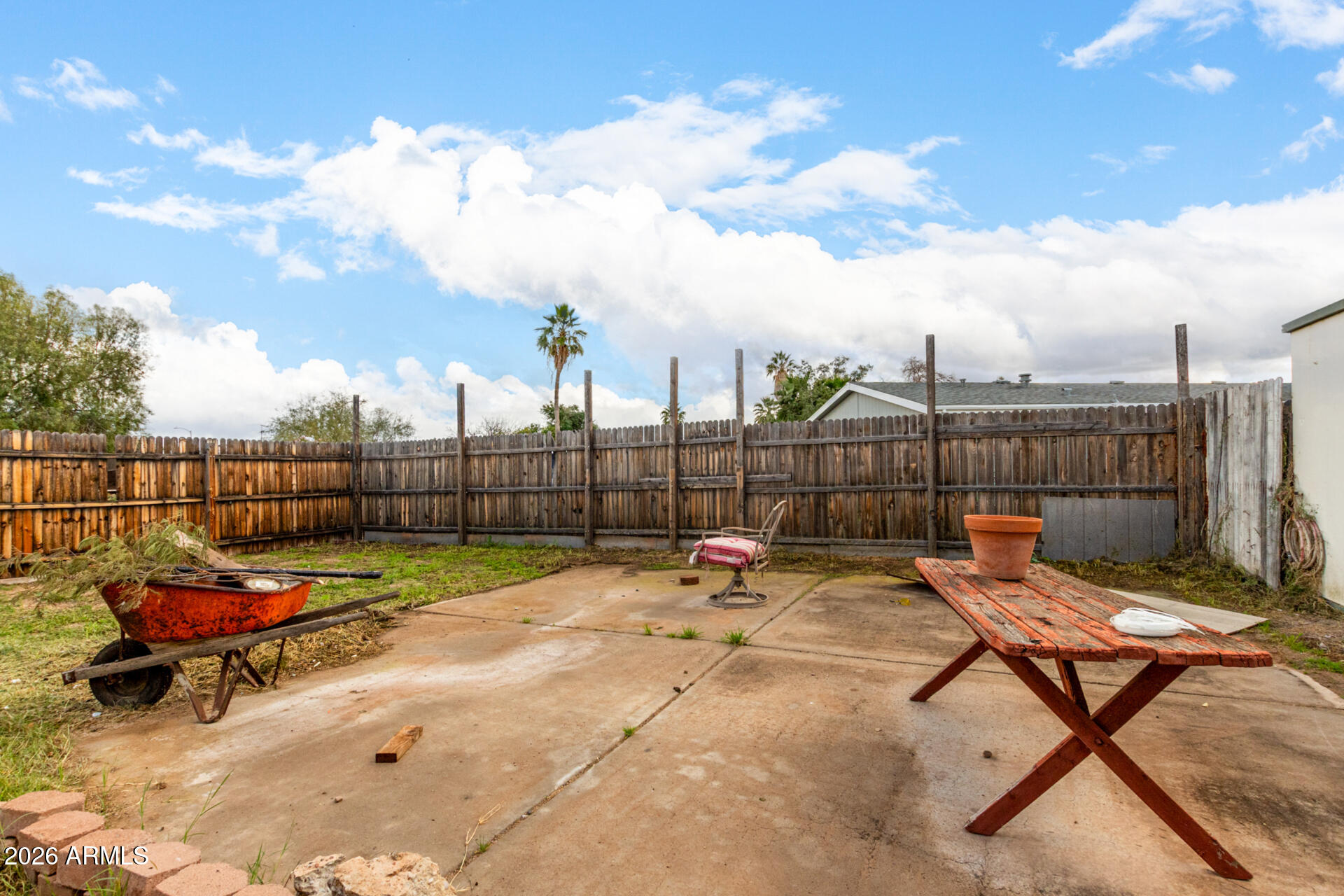 6751 West Nancy Road Peoria, AZ 85382 - Photo 27 of 29 a backyard with a table and chairs