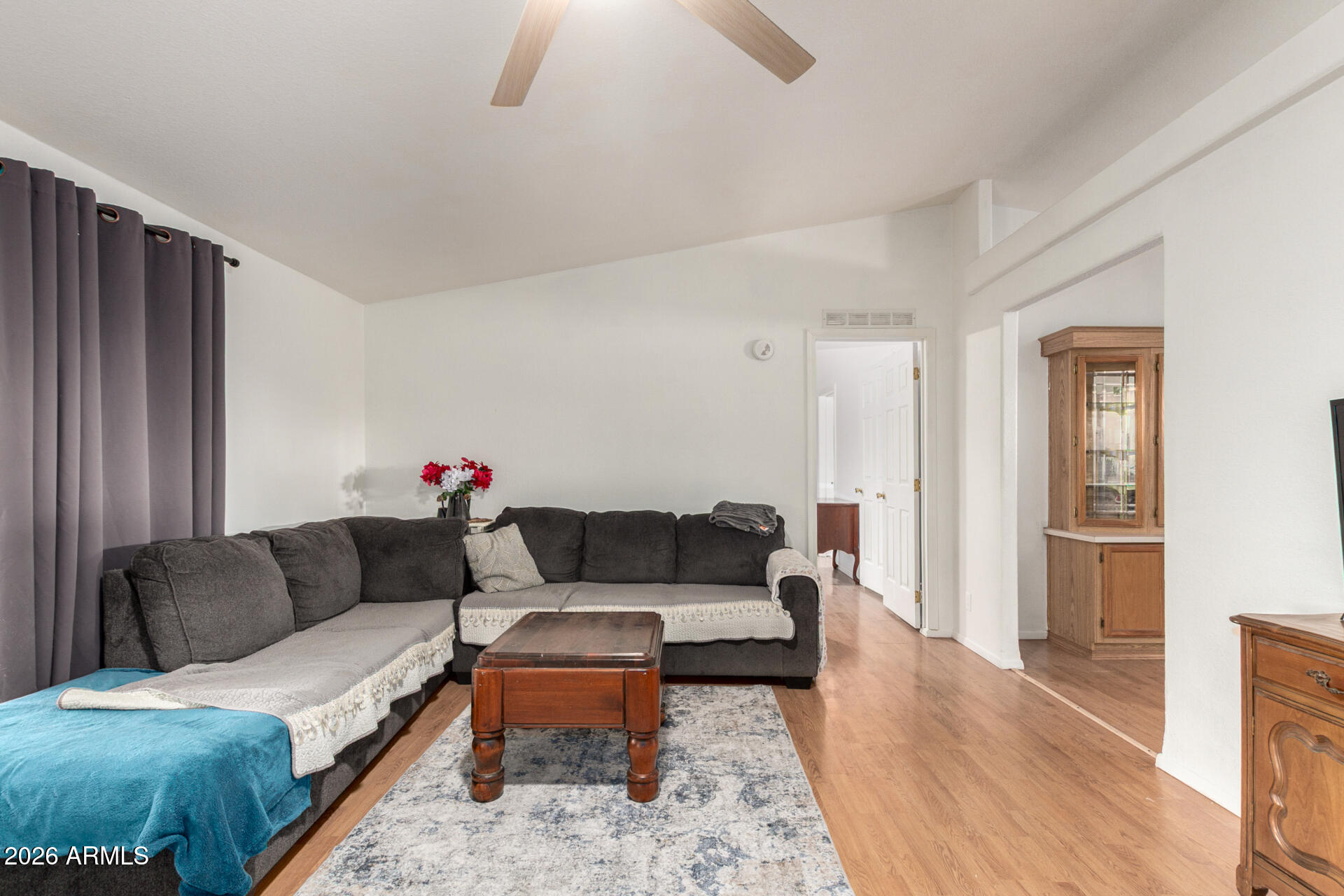 6751 West Nancy Road Peoria, AZ 85382 - Photo 8 of 29 a living room with furniture and wooden floor
