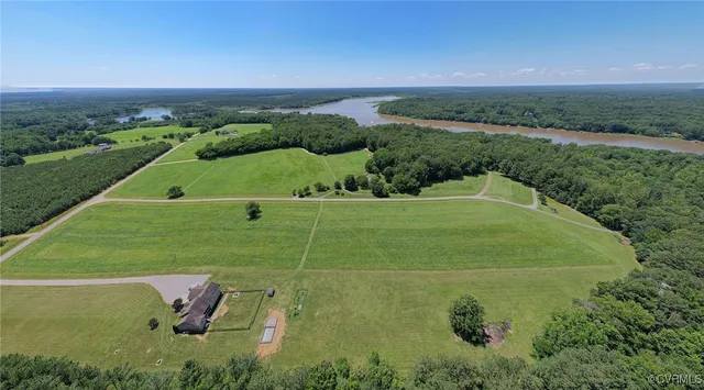 a view of a big yard with large trees