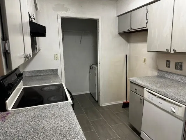 a kitchen with a stove and a refrigerator
