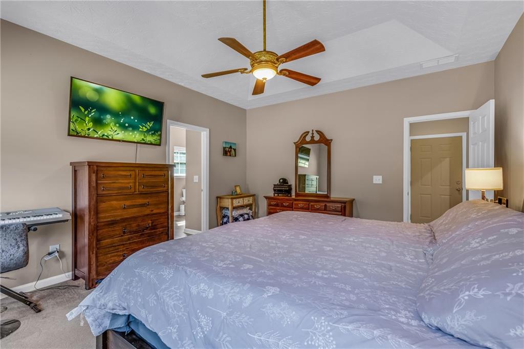 141 High Ridge Trail Jackson, GA 30233 - Photo 15 of 35 a bedroom with a bed and a flat screen tv