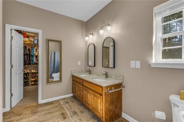 a spacious bathroom with a double vanity sink and a mirror