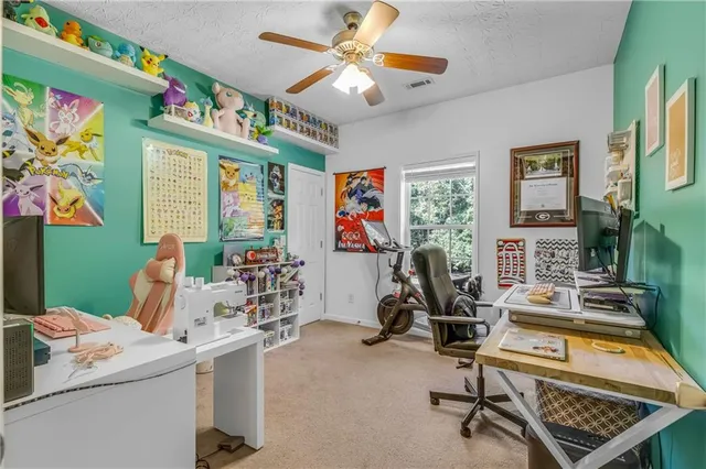 a room with furniture a chandelier and a flat screen tv