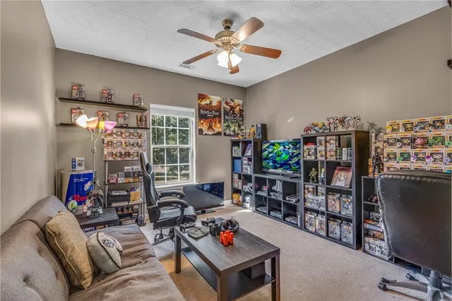 a living room with lots of furniture and a flat screen tv