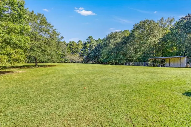 a view of a lake with a yard