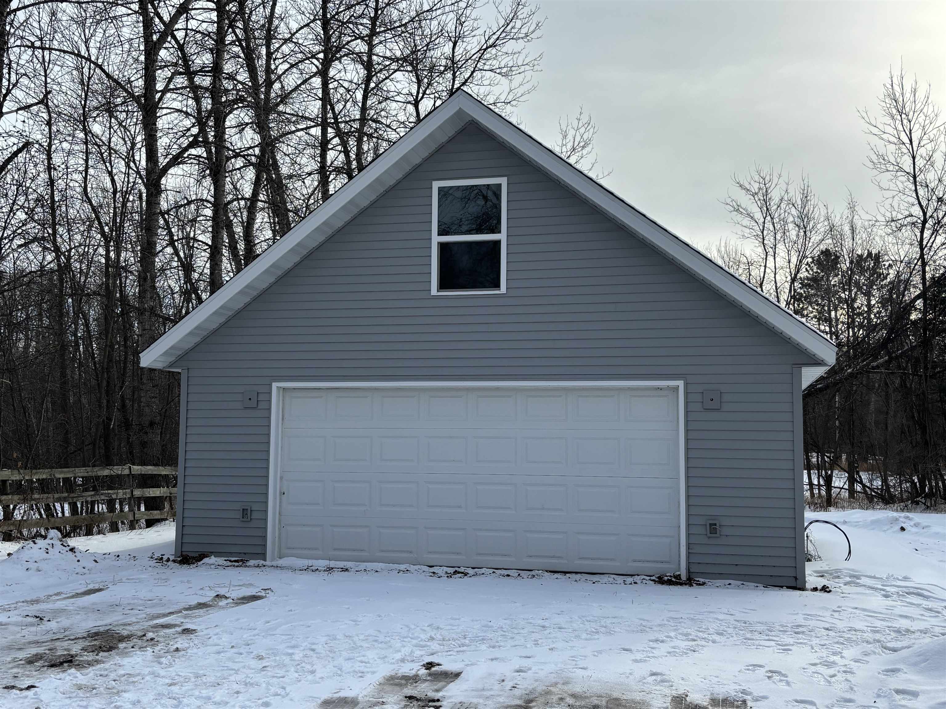 9688 Highway 37 Iron, MN 55751 - Photo 2 of 14 Snow covered garage with a garage