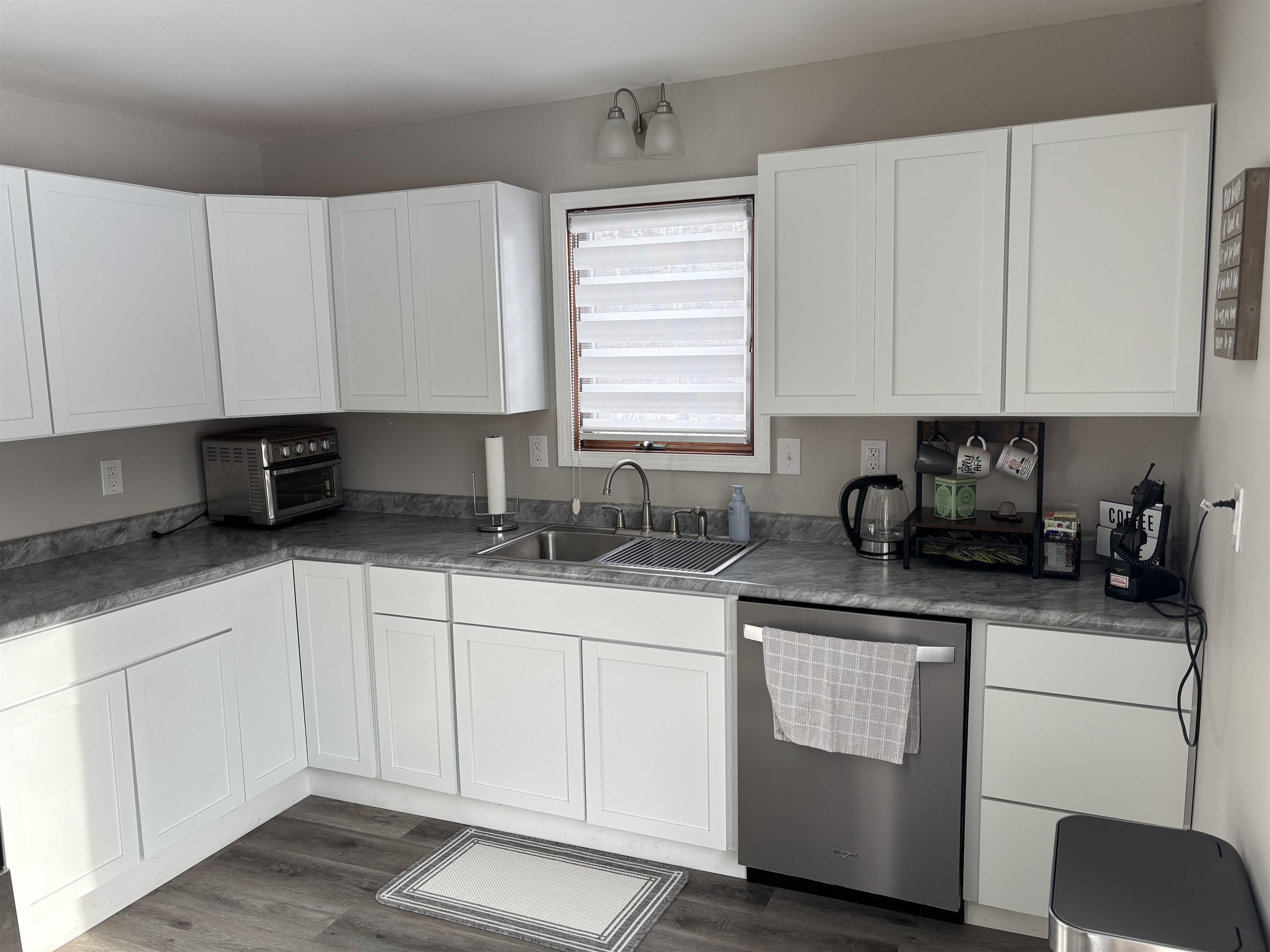 9688 Highway 37 Iron, MN 55751 - Photo 4 of 14 Kitchen featuring dishwasher, white cabinets, and dark wood finished floors