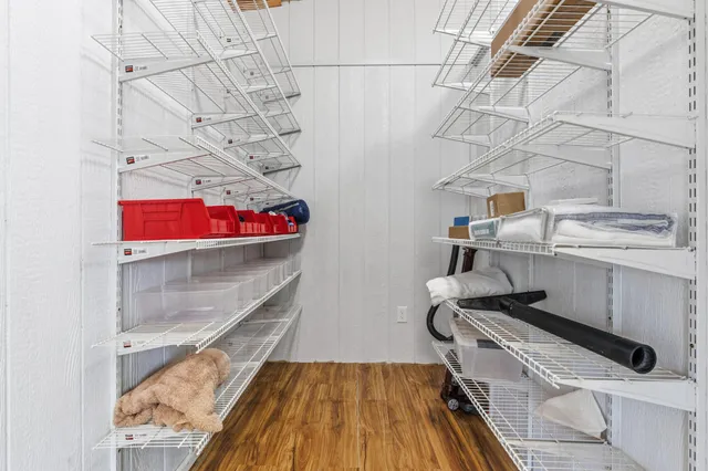 a view of a balcony with lake view and wooden floor