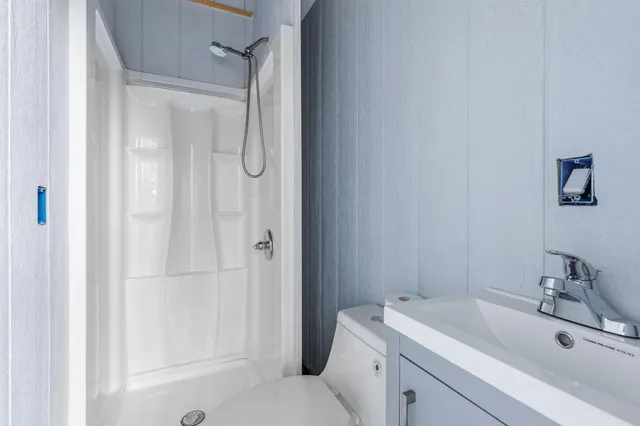 a view of a backyard and swimming pool