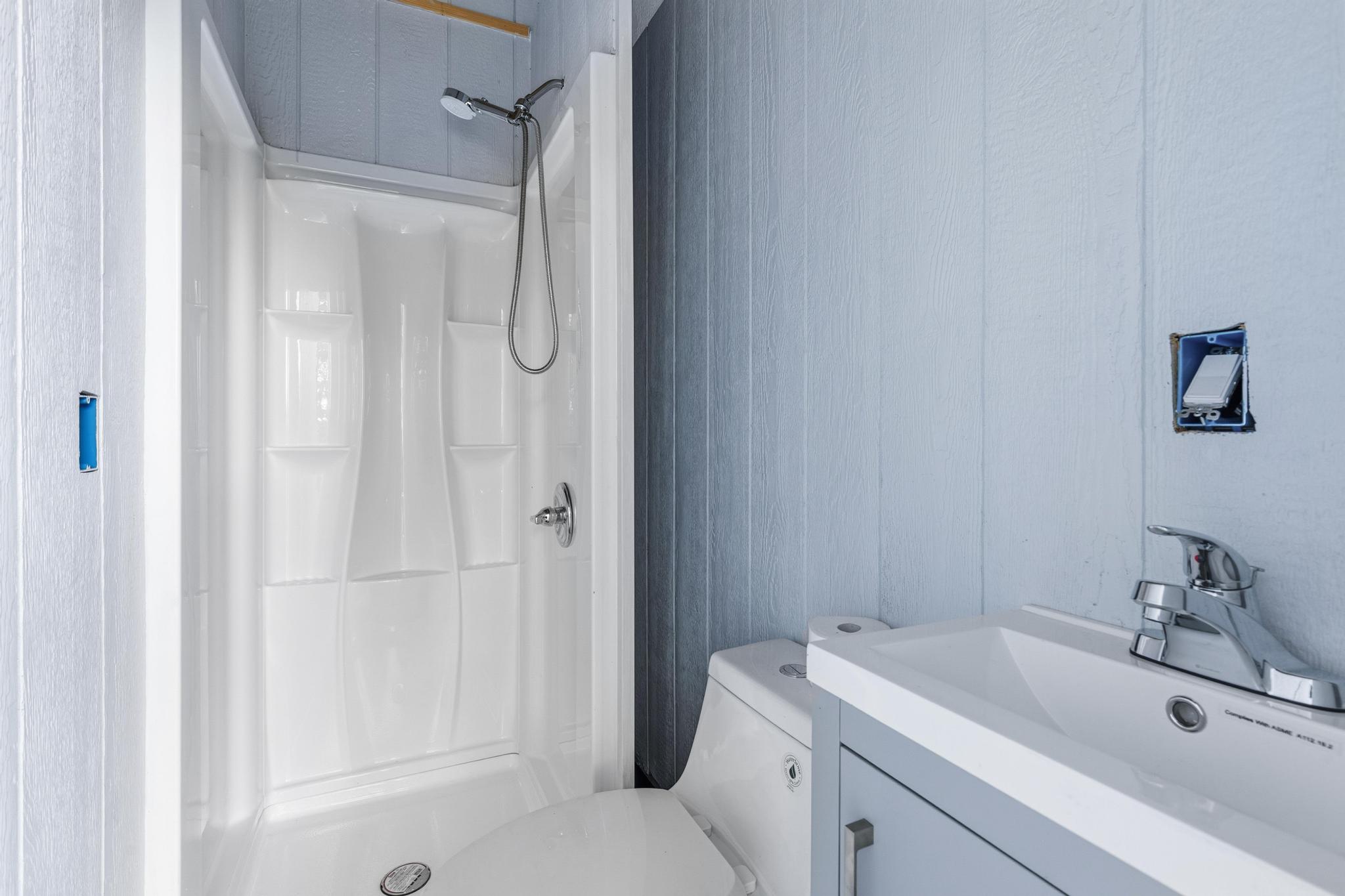 7 Iliopua Road Honomu, HI 96728 - Photo 21 of 30 a bathroom with a sink and a mirror