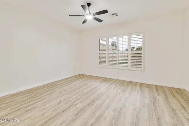 a view of a table and chairs under an umbrella