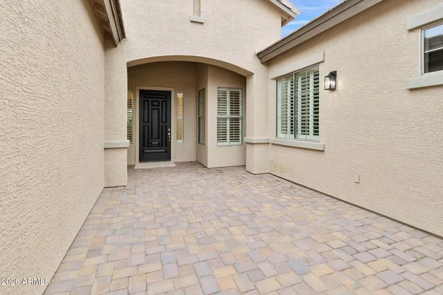 a kitchen with stainless steel appliances granite countertop a sink a stove a microwave and a refrigerator