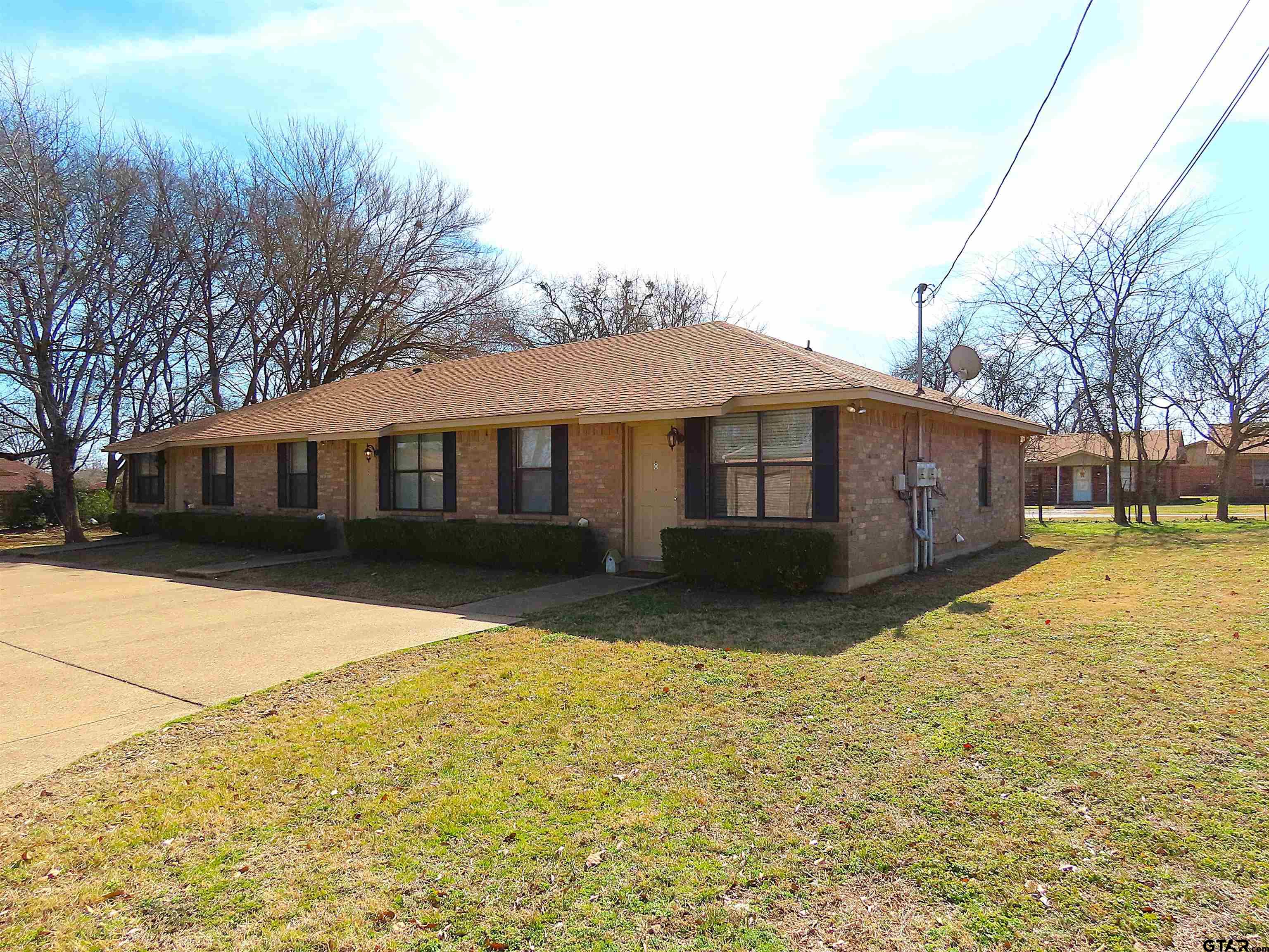 203 Memory Lane, Unit D Whitehouse, TX 75791 - Photo 2 of 16 a front view of a house with a yard