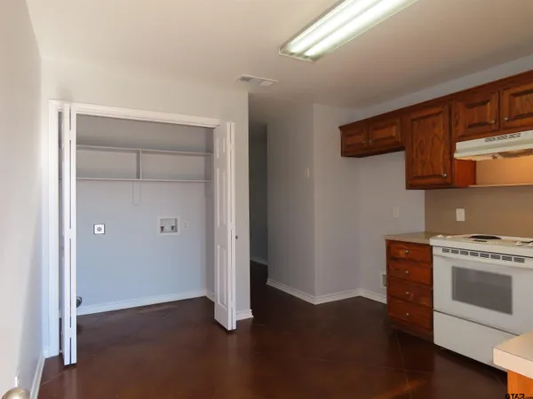 a view of cabinets and wooden floor