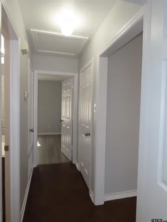 a view of a bathroom from a hallway