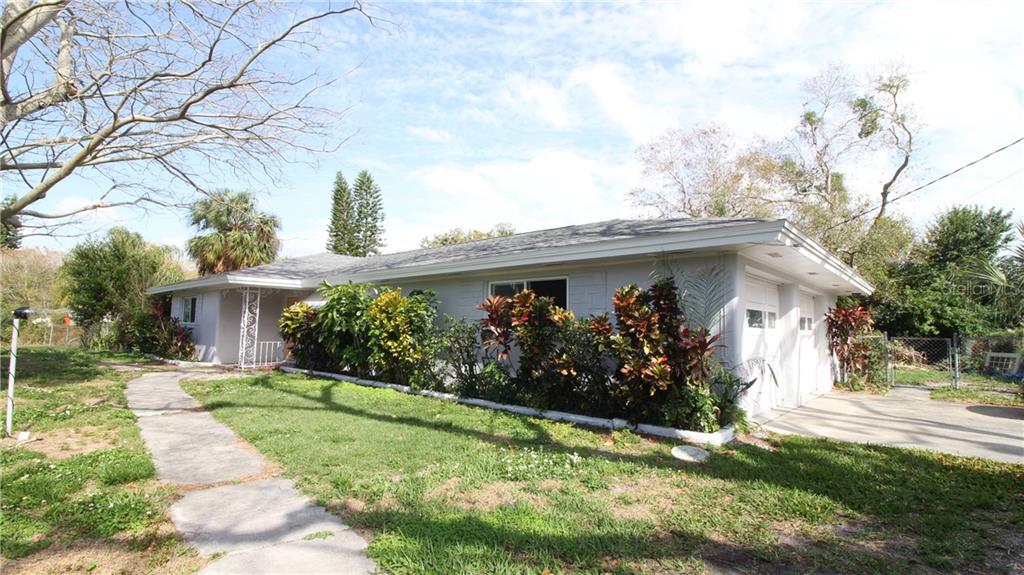1255 South Keene Road Clearwater, FL 33756 - Photo 1 of 1 Front of House with Garage on the side.