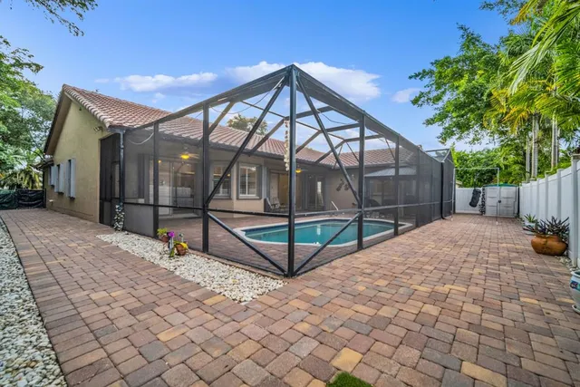 a view of a swimming pool with a patio