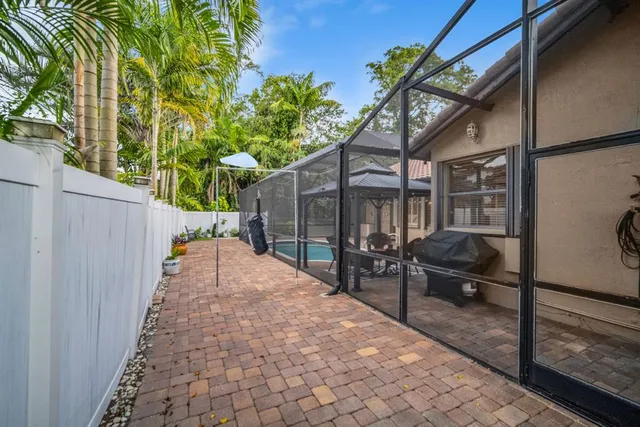 a view of a swimming pool with a patio