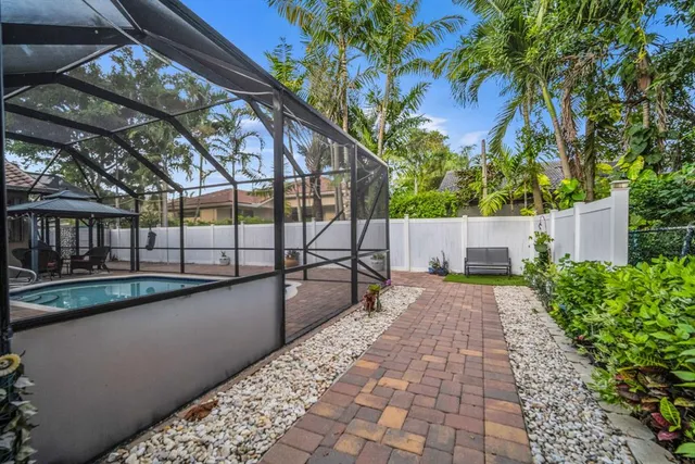 a view of a swimming pool with a patio