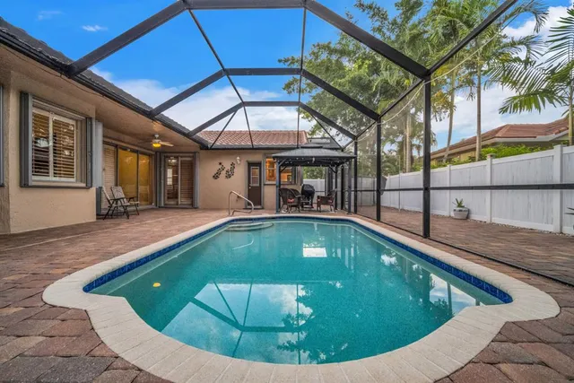 a view of a patio with a table and chairs