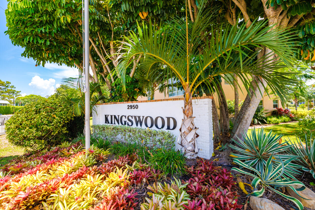 2950 Southeast Ocean Boulevard, Unit 533 Stuart, FL 34996 - Photo 1 of 34 a sign that is sitting in front of flowers