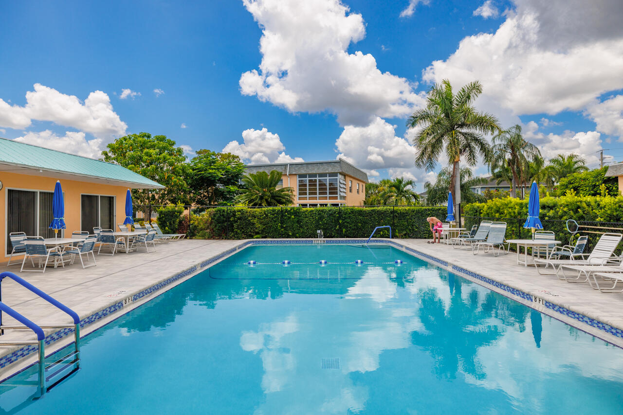 2950 Southeast Ocean Boulevard, Unit 533 Stuart, FL 34996 - Photo 25 of 34 a view of a house with swimming pool and sitting area