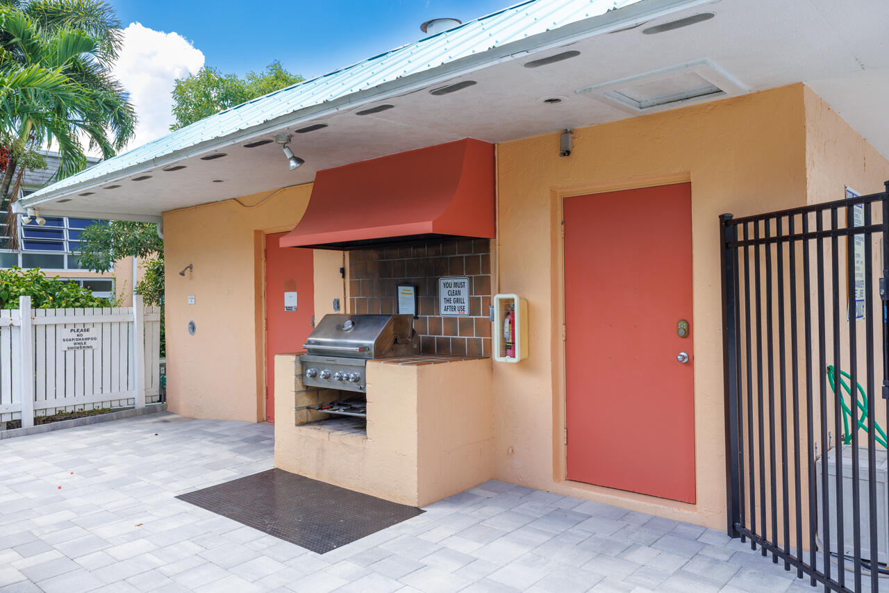 2950 Southeast Ocean Boulevard, Unit 533 Stuart, FL 34996 - Photo 27 of 34 a front view of a house with a garage