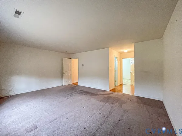 an empty room with windows