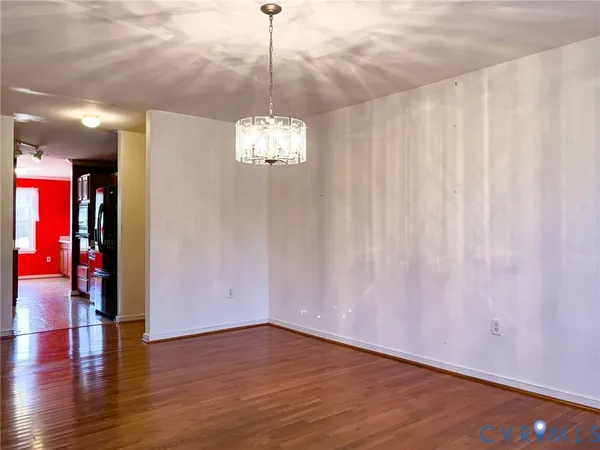 a kitchen with stainless steel appliances granite countertop wooden cabinets a refrigerator and dishwasher