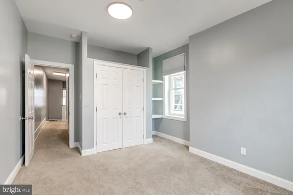 wooden floor and closet in a room