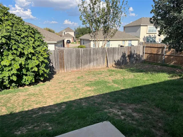 a view of a backyard with a garden
