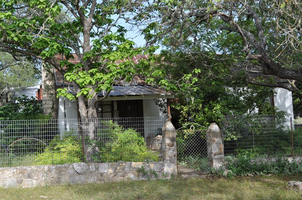 18043 Ranch To Market Road 479 Harper, TX 78631 - Photo 9 of 10 a front view of a house with a garden