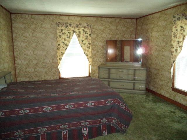325 Newtown Road Buchanan, VA 24066 - Photo 29 of 39 Upstairs bedroom #1 w/ hdwds under rug