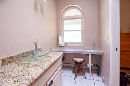 480 Camino Ramanote Rio Rico, AZ 85648 - Photo 18 of 43 Another angle primary bathroom vanity and window.