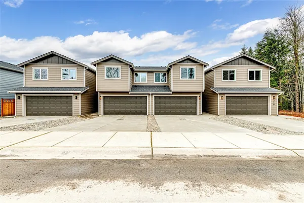 a front view of a house with a garage