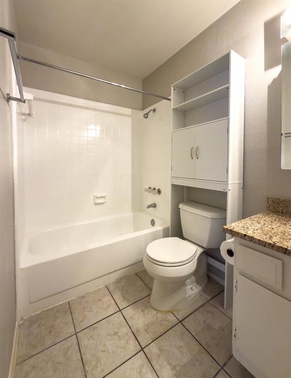 6646 East Lovers Lane, Unit 602 Dallas, TX 75214 - Photo 12 of 19 a bathroom with a granite countertop bathtub shower sink vanity and toilet