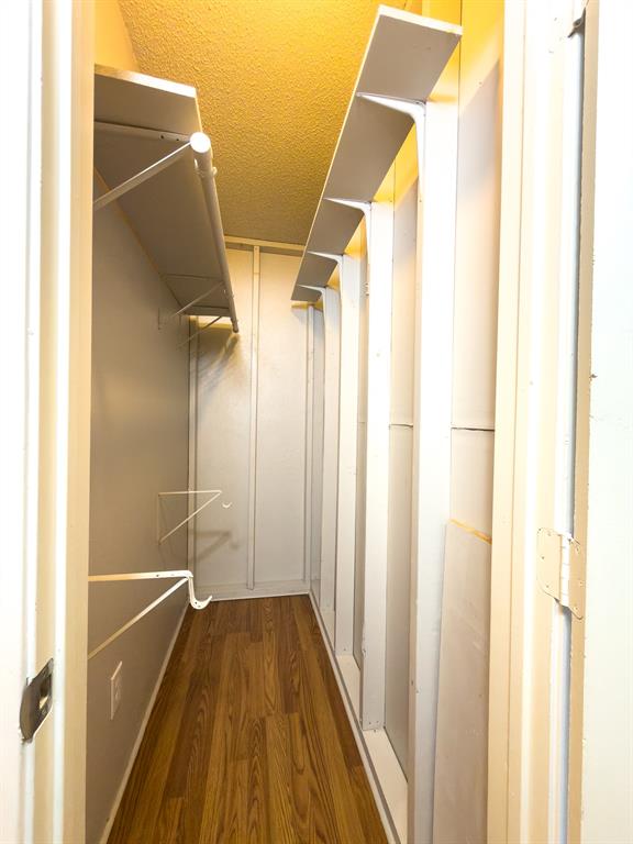 6646 East Lovers Lane, Unit 602 Dallas, TX 75214 - Photo 17 of 19 a view of walk in closet with empty racks