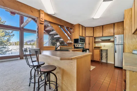 a kitchen with stainless steel appliances a stove cabinets and a kitchen view