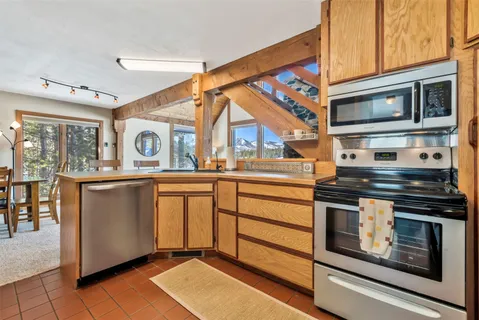 a kitchen with appliances cabinets and a sink