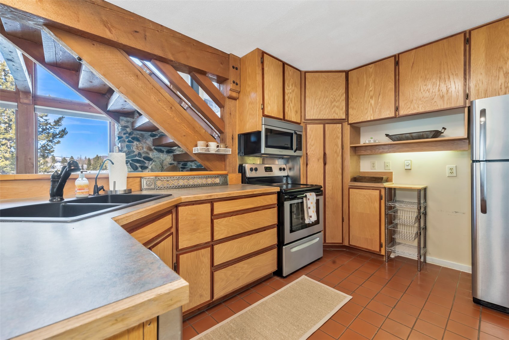 23628 County Road 62 Clark, CO 80428 - Photo 12 of 50 a kitchen with stainless steel appliances a stove cabinets and a kitchen view