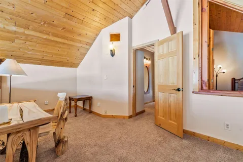 a bedroom with a bed closet and window