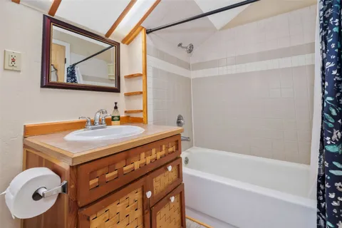 a bedroom with a bed and dresser