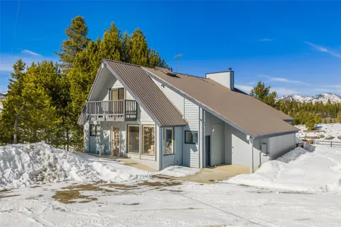 a view of a house with a snow